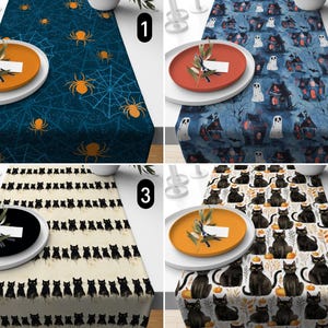 May include: Four different Halloween table runners with various designs. The first runner features a blue background with white spiderwebs and orange spiders. The second runner has a blue background with white ghosts and houses. The third runner has a cream background with black cats. The fourth runner has a white background with black cats, pumpkins, and leaves.
