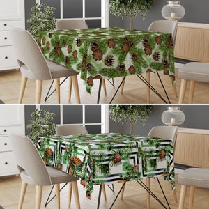 May include: Two images of a table with a green and brown pine cone patterned tablecloth. The table is set with two chairs on each side. The tablecloth is made of a soft, durable fabric and is perfect for everyday use.
