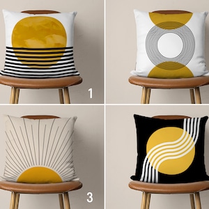 May include: Four different throw pillow designs featuring abstract geometric patterns with a yellow sun motif. The pillows are on brown chairs with white backgrounds.