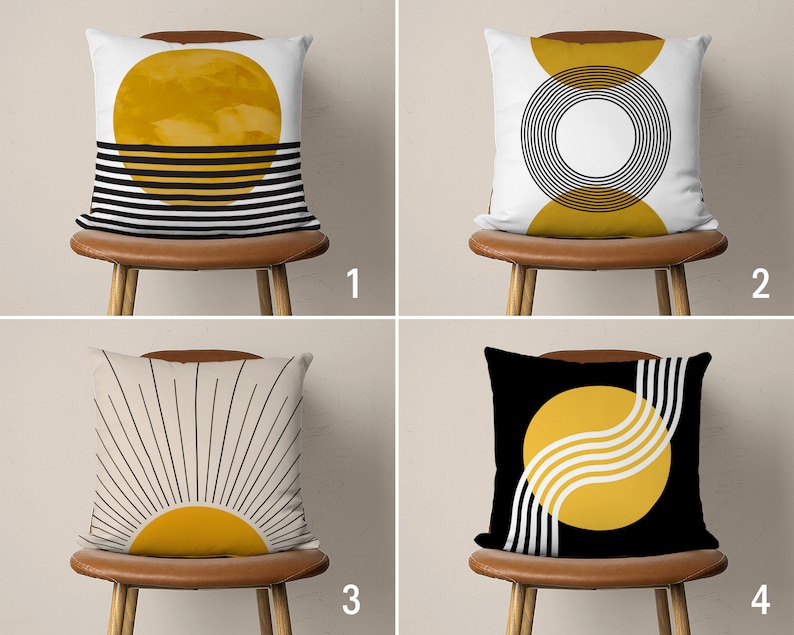 May include: Four different throw pillow designs featuring abstract geometric patterns with a yellow sun motif. The pillows are on brown chairs with white backgrounds.
