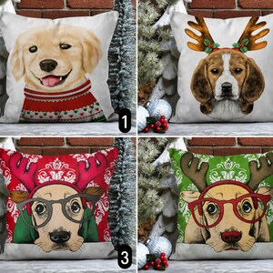 May include: Four different throw pillow designs featuring dogs dressed up as reindeer. The pillows are all white with red and green accents. The dogs are all wearing antlers and red noses. The first pillow features a golden retriever, the second pillow features a beagle, the third pillow features a terrier with glasses, and the fourth pillow features a terrier with glasses.