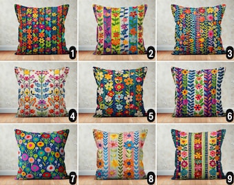 May include: Ten colorful throw pillow covers with floral and geometric patterns. The pillows feature a variety of colors, including blue, green, red, yellow, and pink. The patterns are all unique and eye-catching.