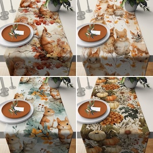 May include: Four different table runner designs featuring autumnal themes. The first runner features squirrels and leaves in shades of brown, orange, and yellow. The second runner features bunnies and leaves in shades of brown, white, and beige. The third runner features squirrels and leaves in shades of green, brown, and yellow. The fourth runner features pumpkins and leaves in shades of orange, brown, and yellow.