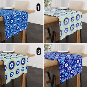 May include: Four table runners featuring a blue and white evil eye design. The runners are displayed on wooden tables and numbered 1 to 4.
