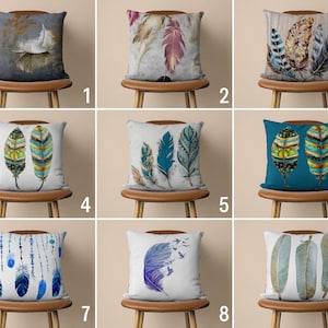 May include: Nine different throw pillow designs featuring various feather patterns in shades of blue, green, brown, and white. The pillows are displayed on wooden chairs with a light brown finish.