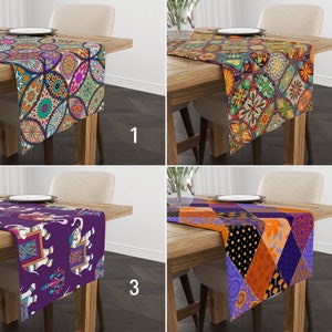 May include: Four different table runners with various colorful patterns. The table runners are made of fabric and have a variety of designs, including geometric patterns, floral patterns, and animal patterns. The table runners are all on wooden tables.