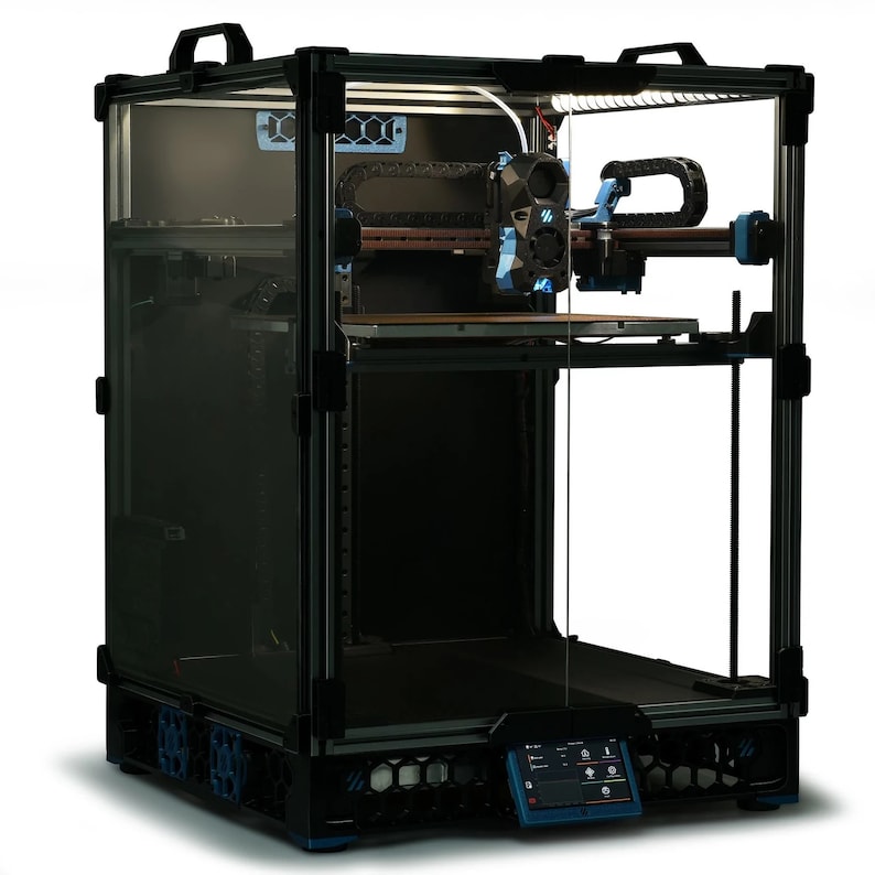 May include: A black 3D printer with a clear plastic enclosure. The printer has a blue and black build platform and a blue and black extruder. The printer is on a white surface.