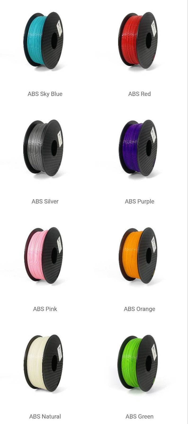 May include: Assortment of 10 spools of ABS filament for 3D printing in various colors, including sky blue, red, silver, purple, pink, orange, natural, and green.