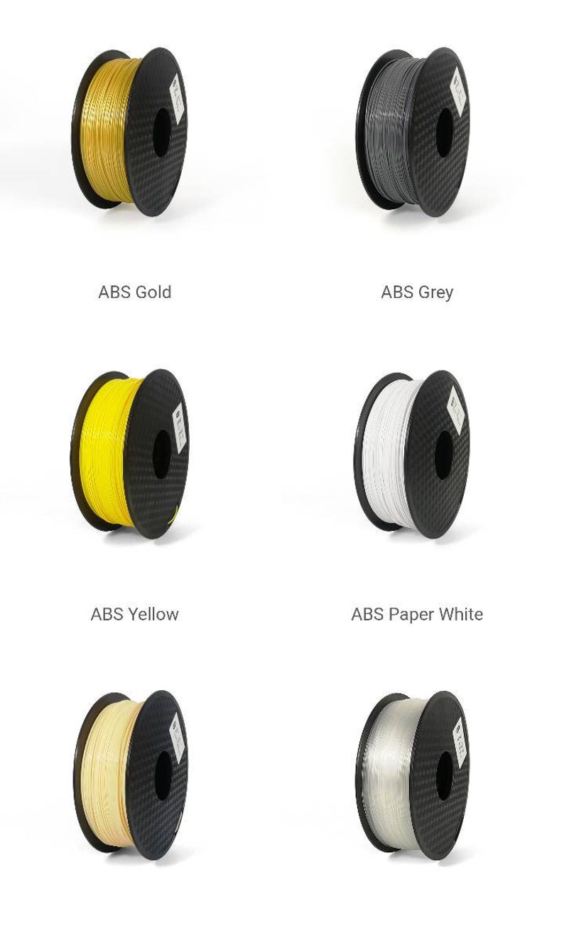 May include: Six spools of 3D printer filament in different colors: gold, gray, yellow, white, beige, and clear. The spools are all black with a carbon fiber pattern.