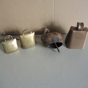 Set of 4 Vintage brass color metal Cow bells / small size Souvenir Bell / Home Décor / Alpine Swiss style Bell / old style animal bell