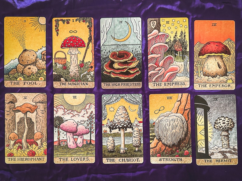 May include: A set of 10 tarot cards featuring illustrations of various mushrooms. Each card has a Roman numeral and a title, such as "The Fool", "The Magician", and "The Empress".