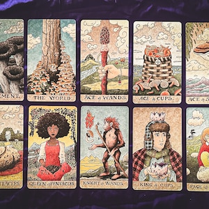 May include: A set of ten tarot cards with illustrations of mushrooms, people, and nature scenes. The cards are in a grid of five rows and two columns. The cards are labeled with their names, such as "Judgement", "The World", "Ace of Wands", "Ace of Cups", "Ace of Swords", "Ace of Pentacles", "Queen of Pentacles", "Knight of Wands", "King of Cups", and "Page of Swords".