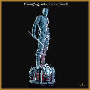 May include: A gray 3D resin model of a vigilante figure, holding a staff. The figure stands on a detailed base with skull and decorative elements. The text "Daring Vigilanty 3D resin model" is at the top.