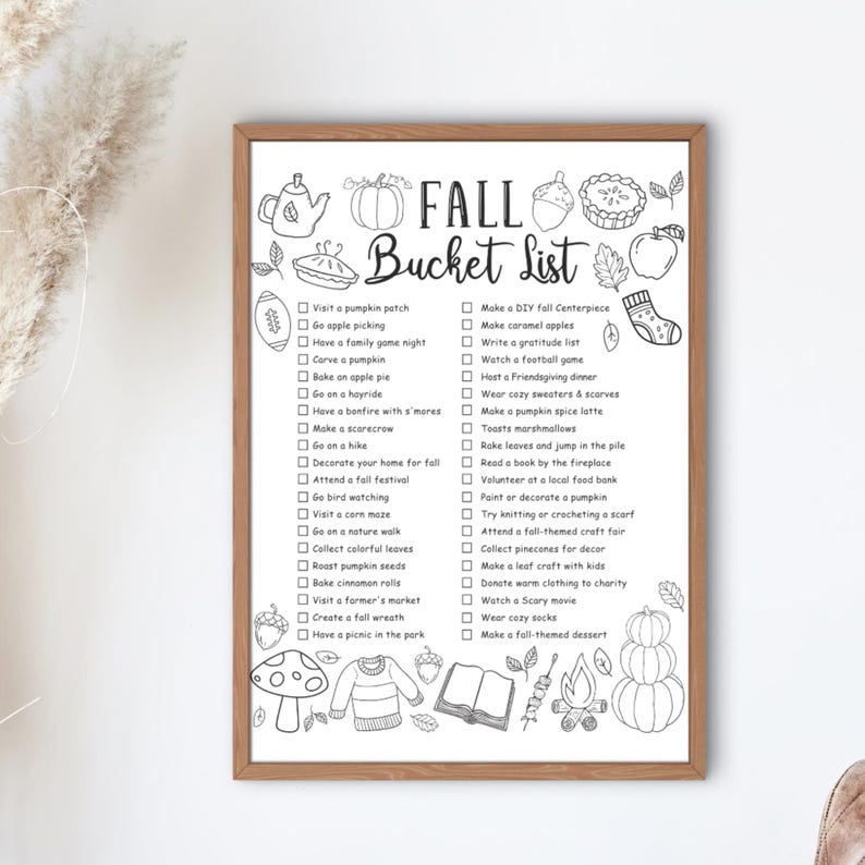 Pode incluir: Uma impress&atilde;o em preto e branco emoldurada da Lista de Desejos de Outono. A lista inclui atividades como visitar um campo de ab&oacute;boras, assar torta de ma&ccedil;&atilde; e participar de um festival de outono. Ilustra&ccedil;&otilde;es decorativas de itens de outono.