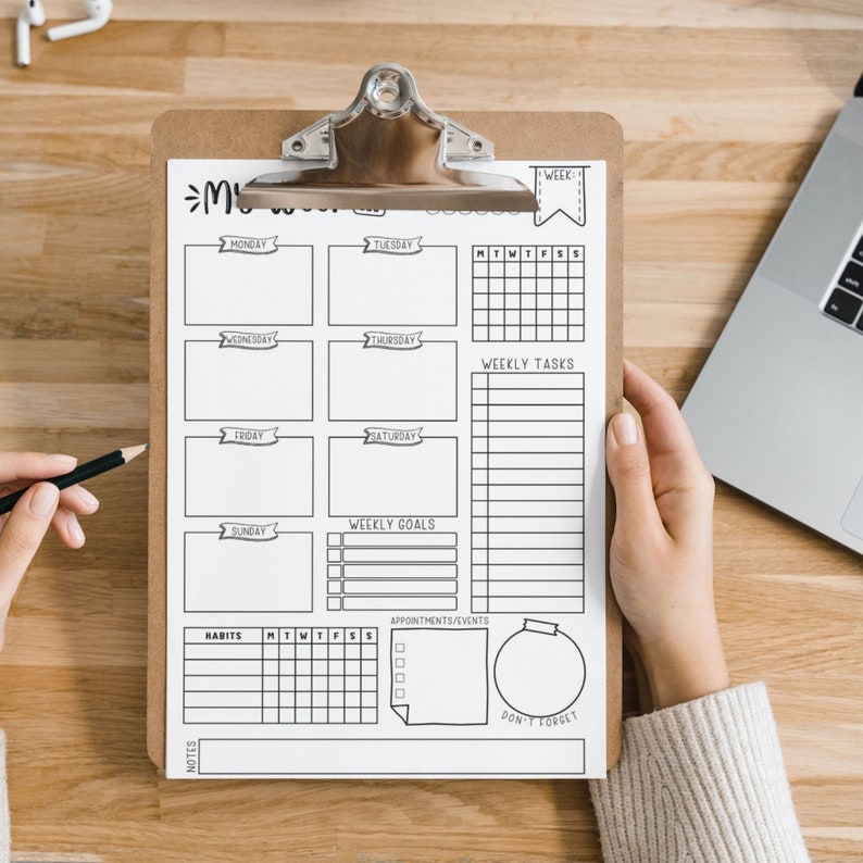 May include: A black and white weekly planner with sections for Monday through Sunday, weekly goals, weekly tasks, appointments and events, habits, and notes. The planner also includes a "Don't Forget" section with a circle for writing.