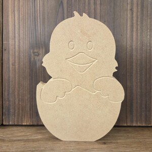 Free standing wood baby chick in egg for a fun do-it-yourself craft.