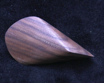 Oloid, palm stone made of walnut, approx. 85 x 46 mm.