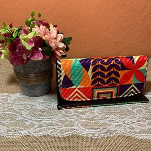 Wallets with small mirror / Carteras con espejo