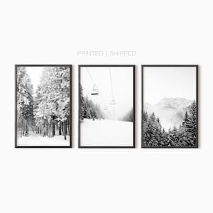 May include: A set of three black and white photographs featuring snowy mountain landscapes. The first image shows a snowy forest, the second shows a ski lift with snowy mountains in the background, and the third shows a snowy mountain range with fog.