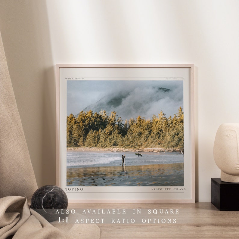 May include: A framed photograph of a misty forest scene with a beach in the foreground. The text "TOFINO" and "VANCOUVER ISLAND" are printed at the bottom of the image.