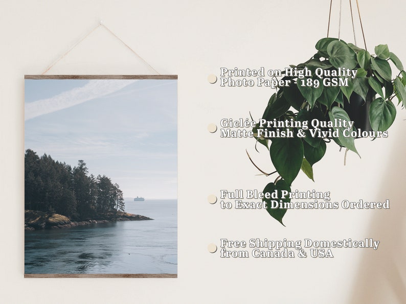 May include: A framed photograph of a scenic landscape with a small island covered in trees and a body of water in the foreground. The sky is a light blue with some clouds. The print is printed on high quality photo paper with a matte finish and vivid colors. The print is full bleed, meaning the image extends to the edges of the paper. The print is available in a variety of sizes.