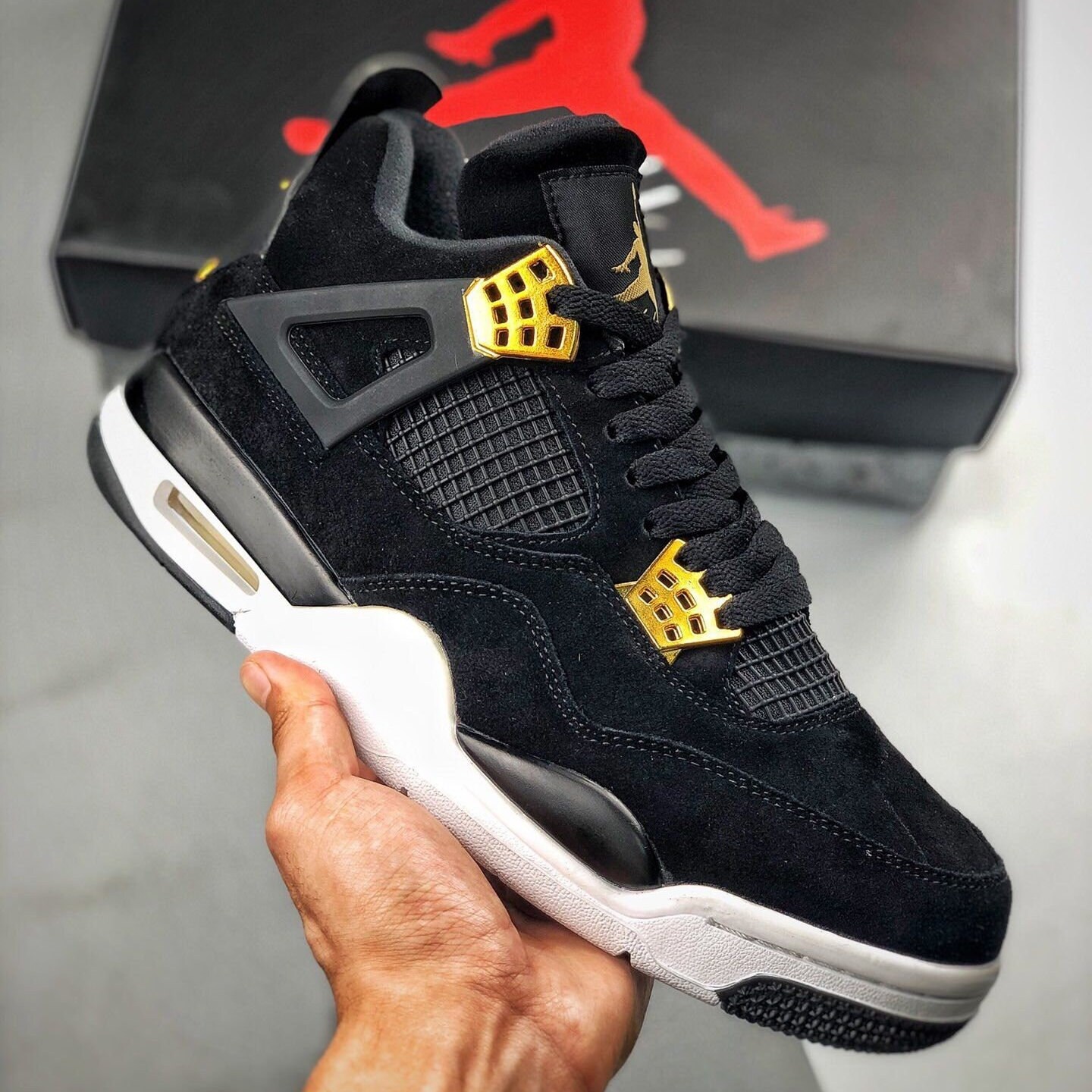 jordans 4 black and gold