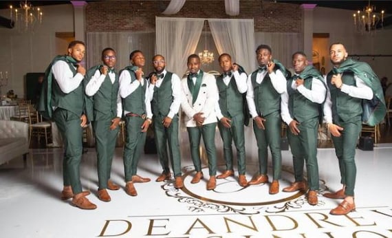 Green bridesmaid dresses top and groomsmen suits