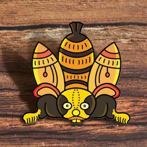 May include: Two enamel pins featuring a stylized creature with a dark brown body, yellow face, and three large, orange and yellow striped, pointed structures extending upward from its back, all outlined in black with a smooth finish.
