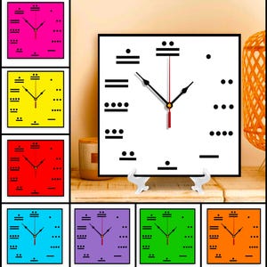 May include: A collection of square clocks in various colors, including pink, yellow, red, blue, purple, green, and orange. Each clock features a unique Mayan-inspired design with black markings and black hands. The central clock is white with black markings.