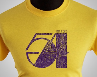 May include: Yellow t-shirt with a purple graphic of the number 54 and the word "STUDIO" above it.