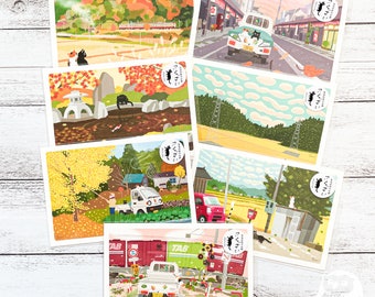 May include: Set of six postcards featuring colorful illustrations of Japanese countryside scenes with cats. Each postcard has a different scene, including a train, a car, a river, and a forest. The postcards are printed on high-quality cardstock and are perfect for sending a note to a friend or adding a touch of whimsy to your home decor.