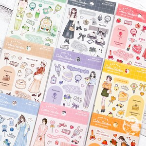 May include: A collection of colorful FUNFAN color sticker sheets. Each sheet features illustrations of women, cakes, bows, and other decorative elements. Text includes "My favorite" and "My love is perfect."