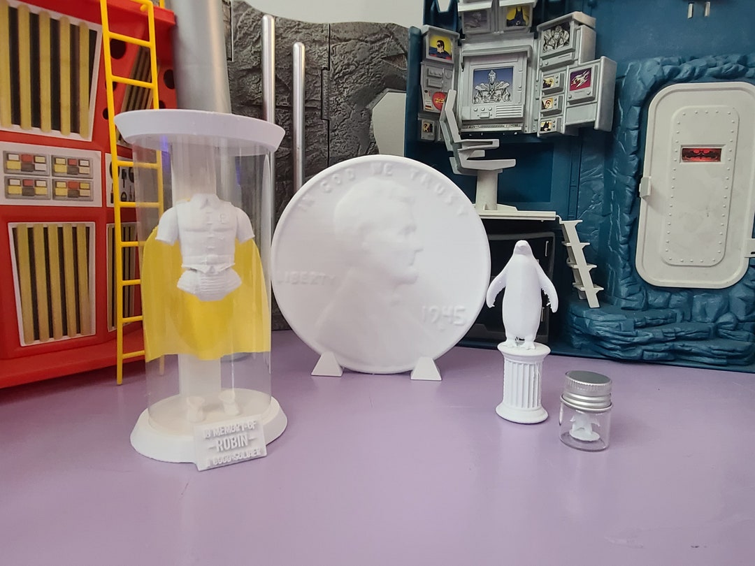 Batcave Trophy Room With Robin Memorial, Giant Penny, Penguin, and