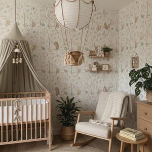 May include: A neutral-toned nursery with a cot, rocking chair, and a circular jute rug. The room has a wallpaper with forest animals and a hot air balloon-shaped light. A small side table holds books, and a dresser is visible.