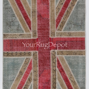 May include: A patchwork rug with a Union Jack design. The rug is made of different colored fabrics, including red, blue, and beige. The rug is sewn together with white thread. The rug has a distressed look, as if it has been used for many years. The text "YourRugDepot" is printed in the center of the rug.