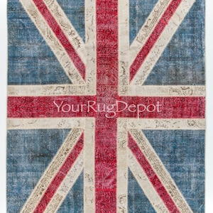 May include: A vintage-style rug with a patchwork design featuring the Union Jack flag. The rug is made of various fabrics in shades of red, white, and blue.