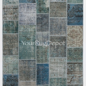 May include: A patchwork rug with a variety of blue and gray tones. The rug is made up of many different squares, each with a unique pattern. The rug is a great way to add a touch of color and style to any room.