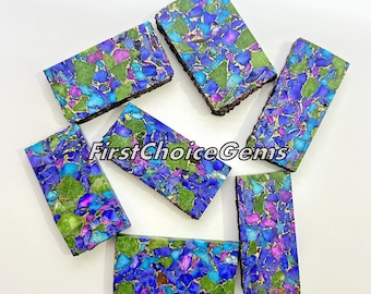 May include: Seven rectangular pieces of blue, green, and gold mosaic stone. The stones are arranged in a random pattern and have a polished finish. FirstChoiceGems is printed on the image.