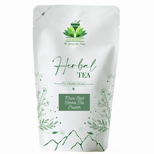May include: A white pouch of herbal tea powder with the text "Herbal Tea" in a script font. The package also features "Maca Root Herbal Tea Powder" and the brand logo. The design includes green floral and mountain illustrations. The text "We Serve the Pure" is at the top.