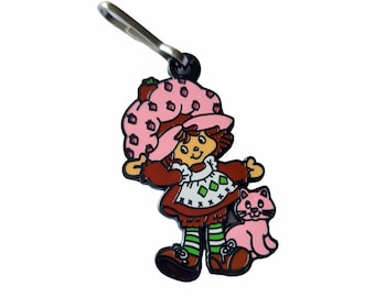 Strawberry Girl Enamel Zipper Pull – 80s 90s Enamel Jacket Clip – Retro Pop Culture Gift – Toy Lover Accessory – Collector’s Charm