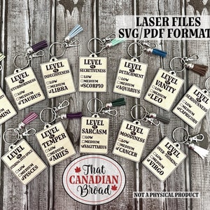 May include: Twelve different zodiac sign themed keychains with a checklist for "level of" personality traits. Each keychain has a different zodiac sign and a checklist with the options "low", "medium", and "high". The keychains are on a wooden background. The text "Laser Files SVG/PDF Formats" is at the top of the image. The text "That Canadian Broad" is at the bottom of the image. The text "Not a physical product" is at the bottom of the image.