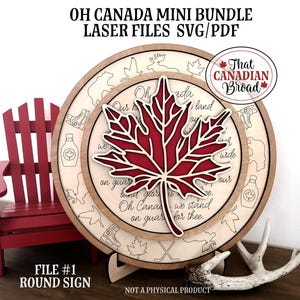 Op de afbeelding: Een rond houten bord met een rood esdoornblad en de tekst van "Oh Canada" in een decoratief lettertype. Het bord staat op een witte geweistandaard. De tekst "Bestand #1 Rond bord" staat onderaan de afbeelding. De tekst "Geen fysiek product" staat onderaan de afbeelding.
