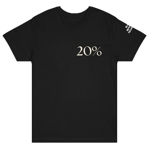 May include: Black t-shirt with the number "20%" printed in a light beige color on the front. The sleeve has the text "BL BEHAV TECH" printed vertically in a light beige color.