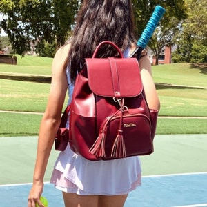 SARA Tennis and Pickleball Backpack- made from fine grained vegan leather, separated pocket for 2 regular size tennis racquets or pickleball