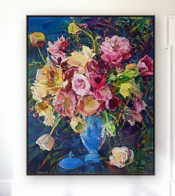 Peonies and roses in a blue vase.