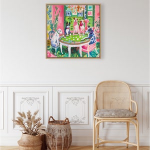 May include: A painting of four dogs playing cards at a table in a pink room. The dogs are wearing collars and are sitting on chairs. The table is white with a green felt top. There are cards on the table and a vase of flowers in the background.