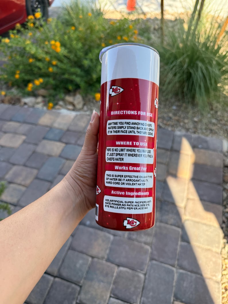 May include: A red and white insulated tumbler with text that reads "DIRECTIONS FOR USE" and "Works Great For". The tumbler has a silver lid and features the Kansas City Chiefs logo.