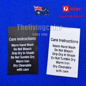 May include: Two black and white care instruction labels with the text "Care Instructions" and a list of instructions including "Warm Hand Wash", "Do Not Bleach", "Drip Dry In Shade", "Do Not Tumble Dry", "Warm Iron", "Dry Cleanable with care".