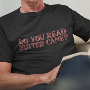 Do you read Sutter Cane? | Unisex Short Sleeve Tee | John Carpenter