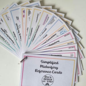 May include: A set of colourful reference cards for midwives, featuring the text "Simplified Midwifery Reference Cards" and "Dee's Design UK Shop".